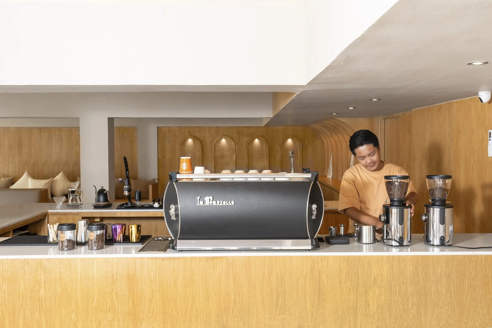 Barista pulling a shot of espresso at the Horange Phuket Town cafe
