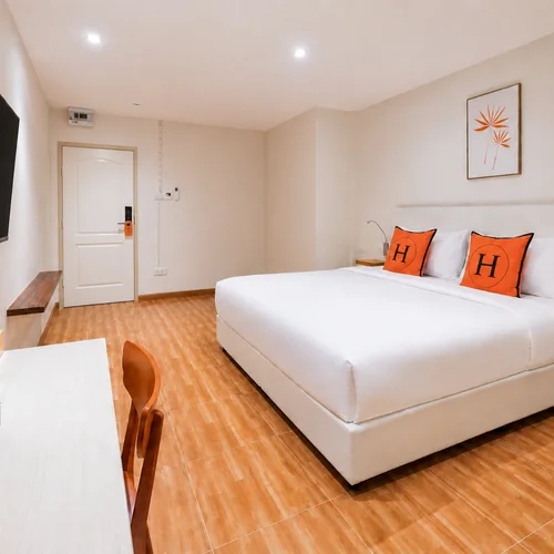 Deluxe room at Horange Phuket Town with an open bathroom layout