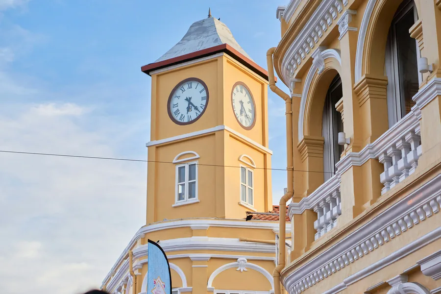 The yellow clock tower in Phuket Old Town, a five minute walk from Horange Phuket Town