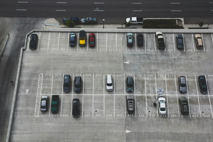 An open car park with marked bays, seen from above